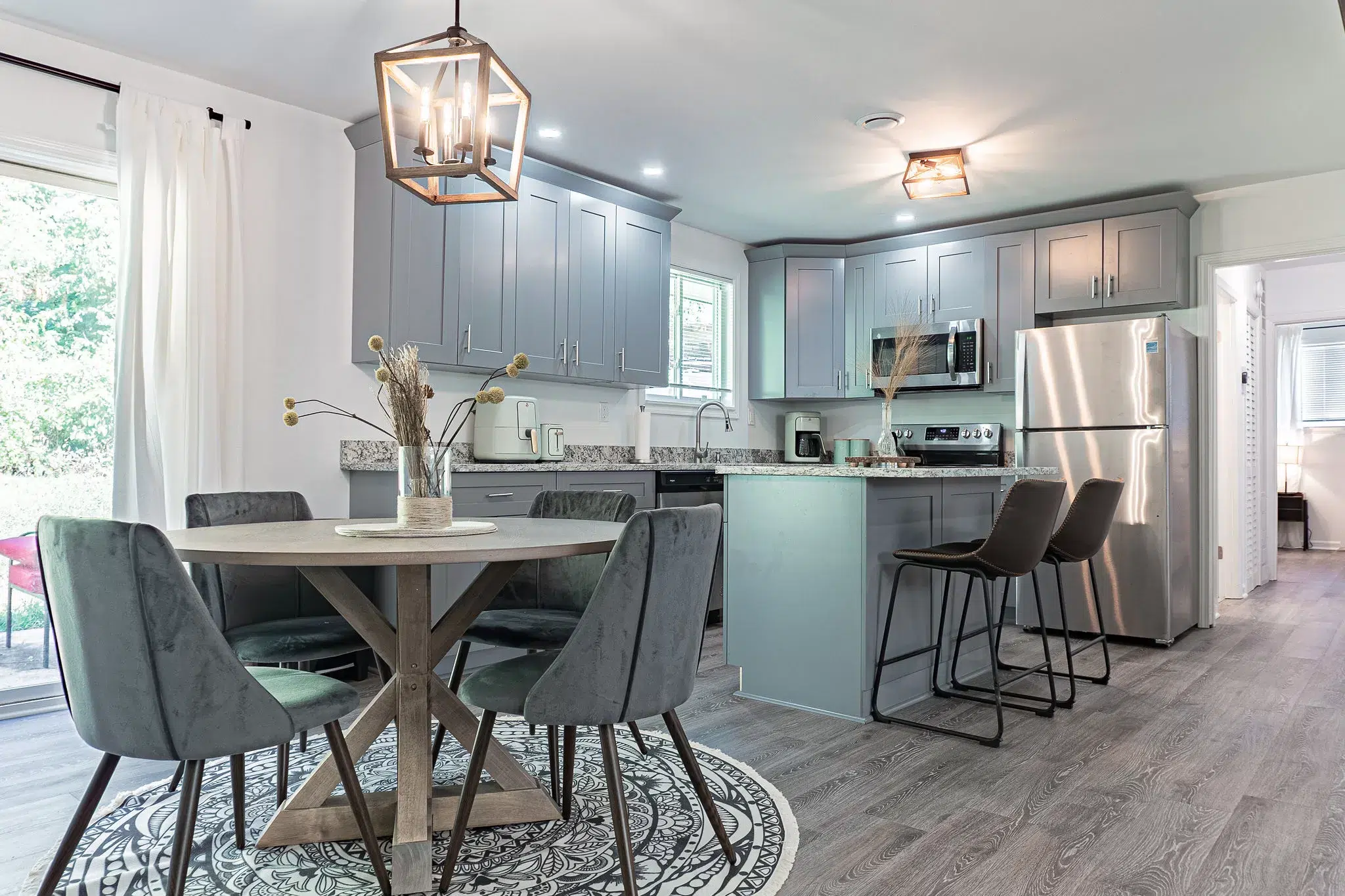 grey kitchen with dining room set