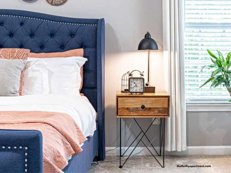 narrow nightstand next to bed
