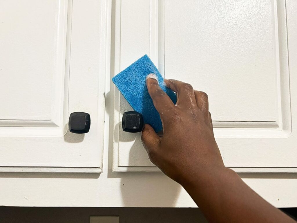 cleaning cabinet with sponge