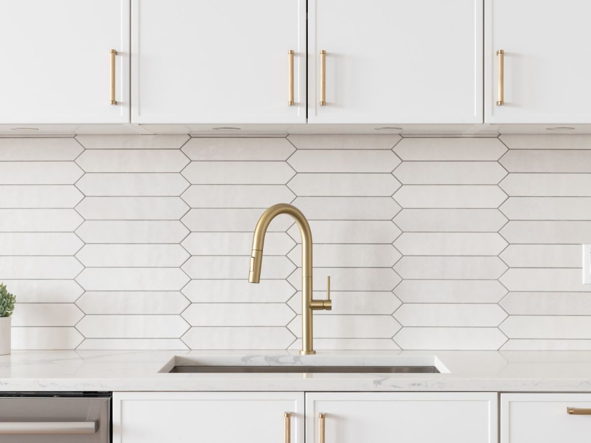 kitchen with gray grout and gold hardware