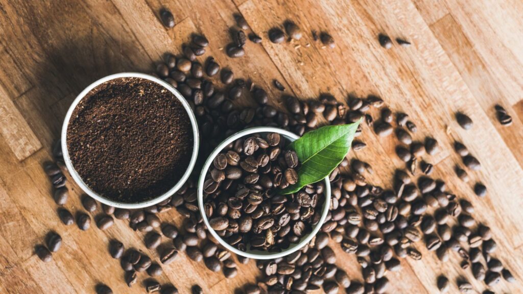 coffee grounds and beans on table