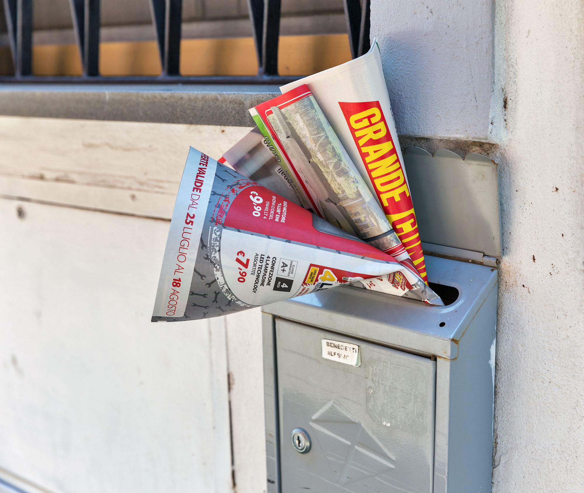 Printed advertising and promotional newspapers in the mailbox.