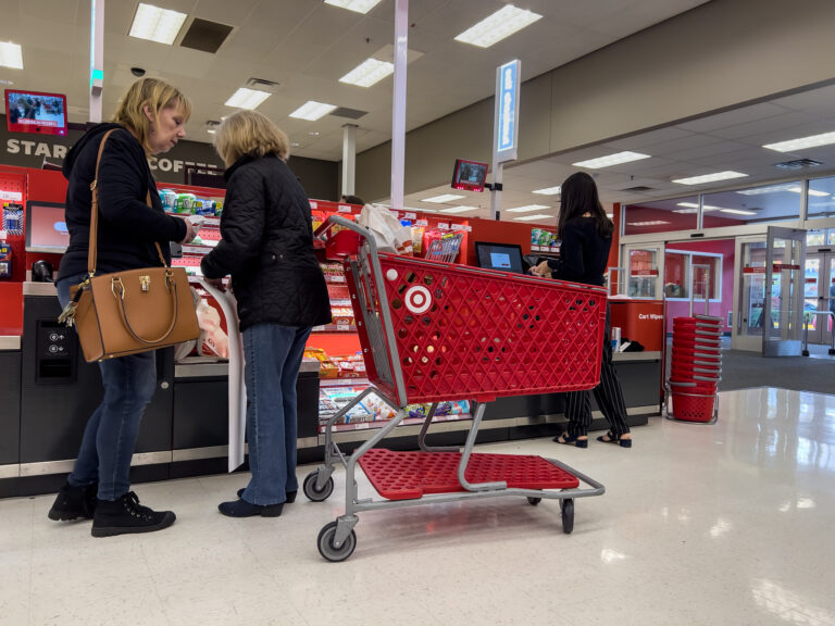 Wide view of people using the self checkout inside a Target retail store.