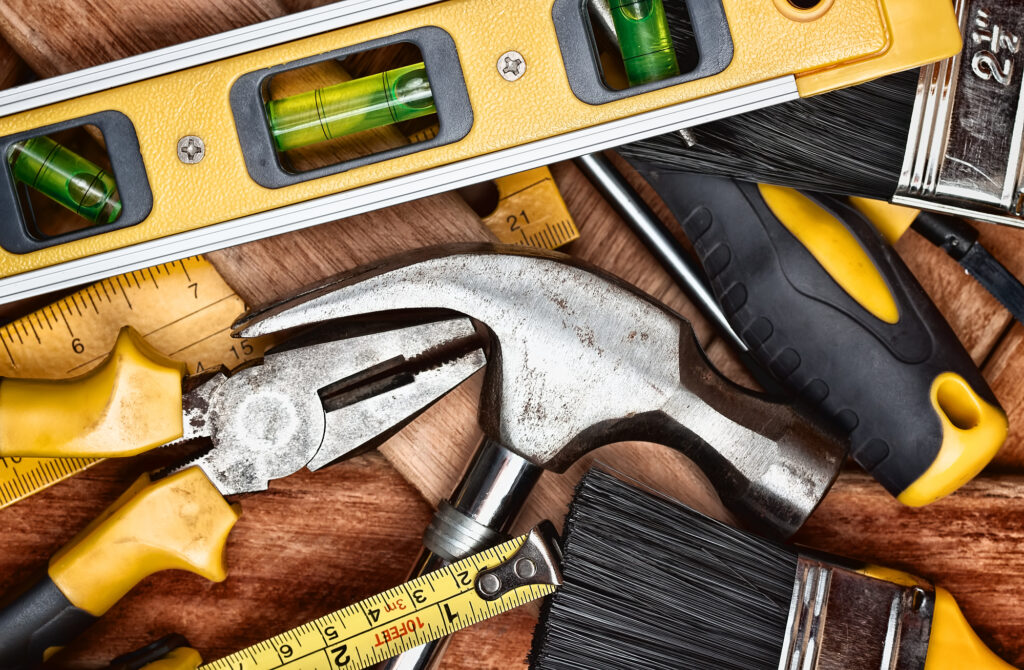 assortment of tools, hammer, leveler, screwdriver