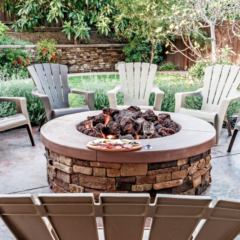 fire pit with adirondack chairs canva