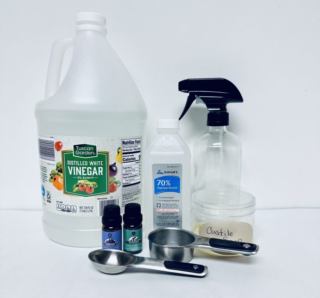 ingredients essential oil, spray bottle, measuring spoon, rubbing alcohol