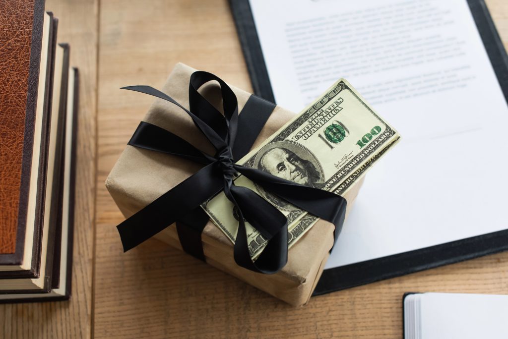 cash wrapped in gift box
