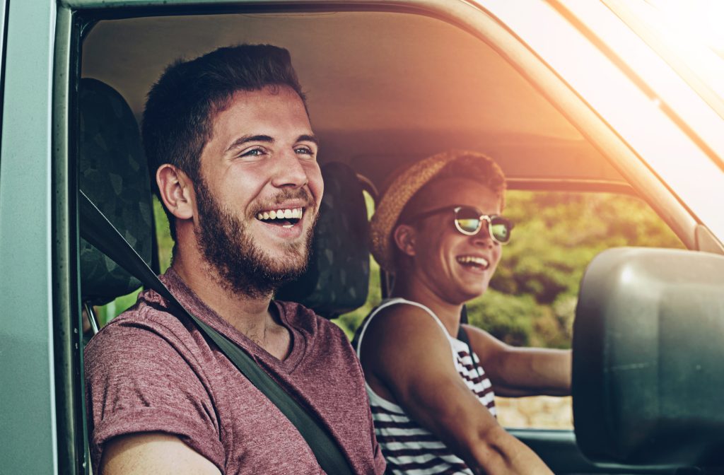 Friends, road trip and happy in car for travel, together and journey with explore, adventure and vacation. People, smile and excited in van or suv with transport for summer, crazy drive and freedom
