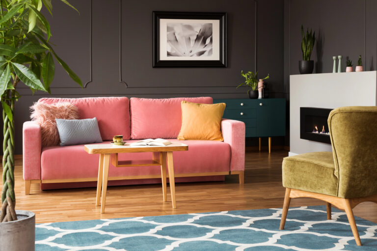 living room with pink couch yellow chair