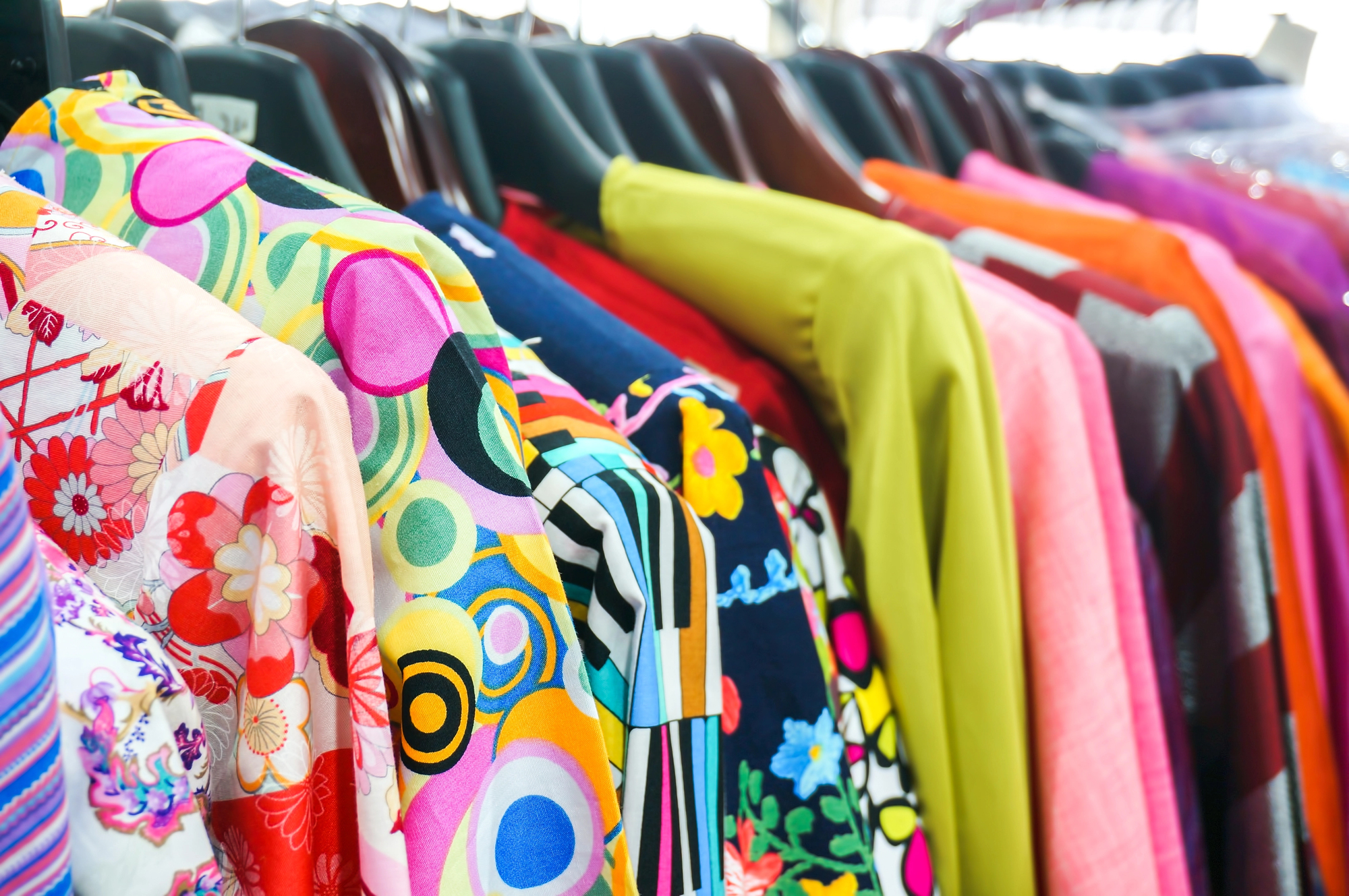 thrifted clothes on rack