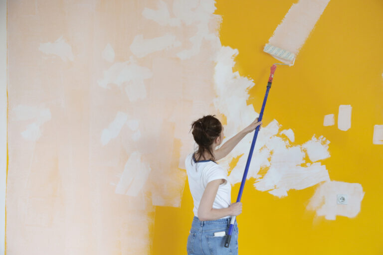 woman painting a wall