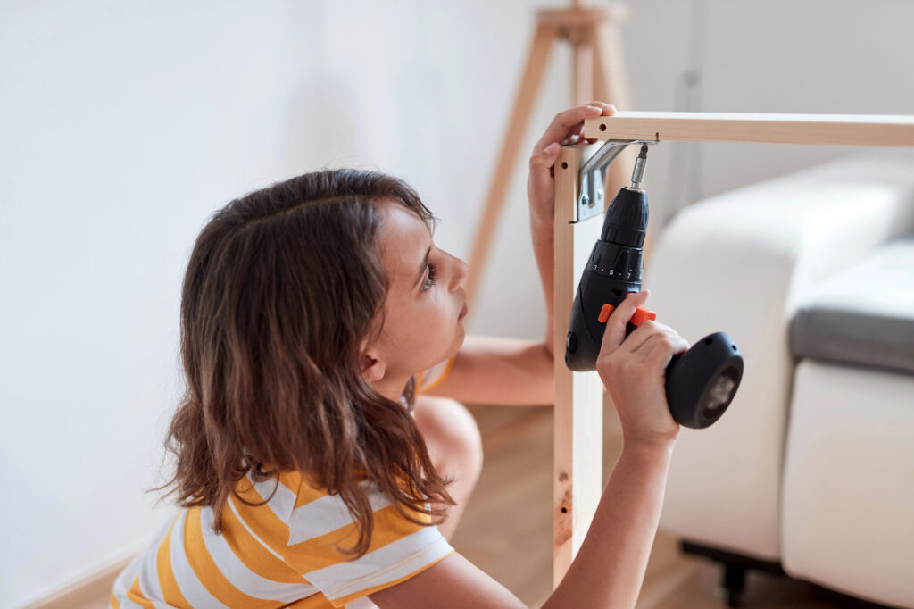 girl assembling furniture
