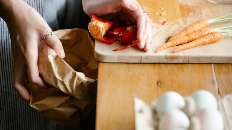 woman cleaning countertop with food