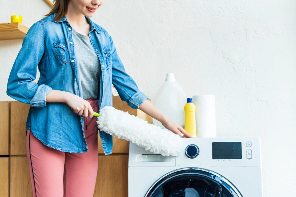 woman cleaning washing machine