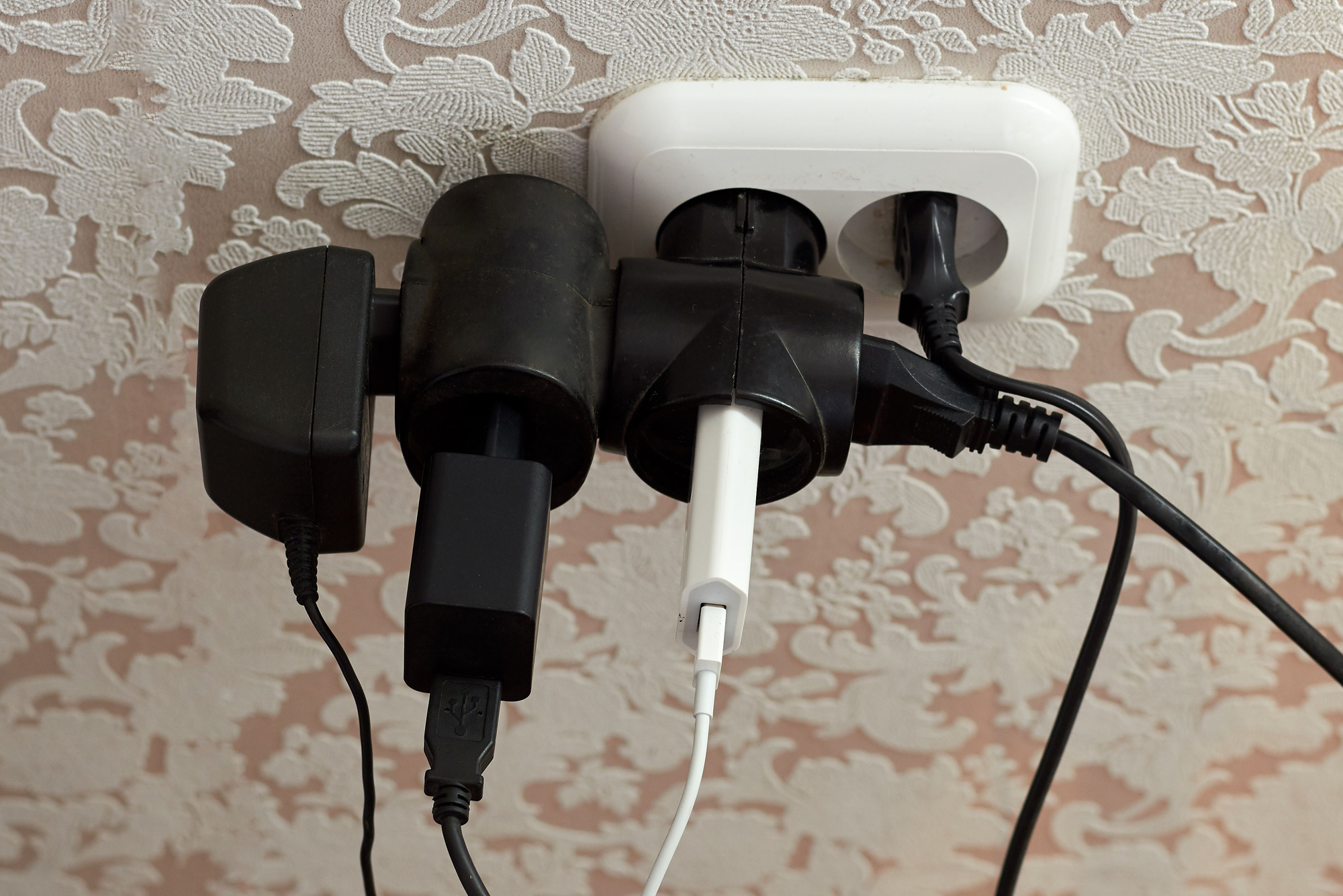 Improper use power supply. Overloaded socket, spark. Danger of electric shock, fire. Wire, plug, wall, fire.