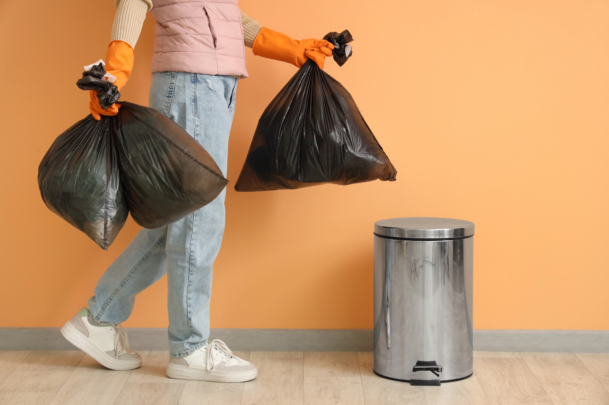 woman putting stuff in the trash