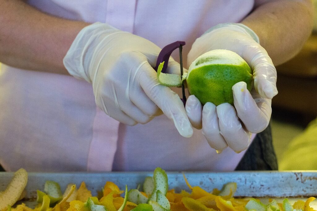 1280px Chef uses a Y peeler to peel a lime