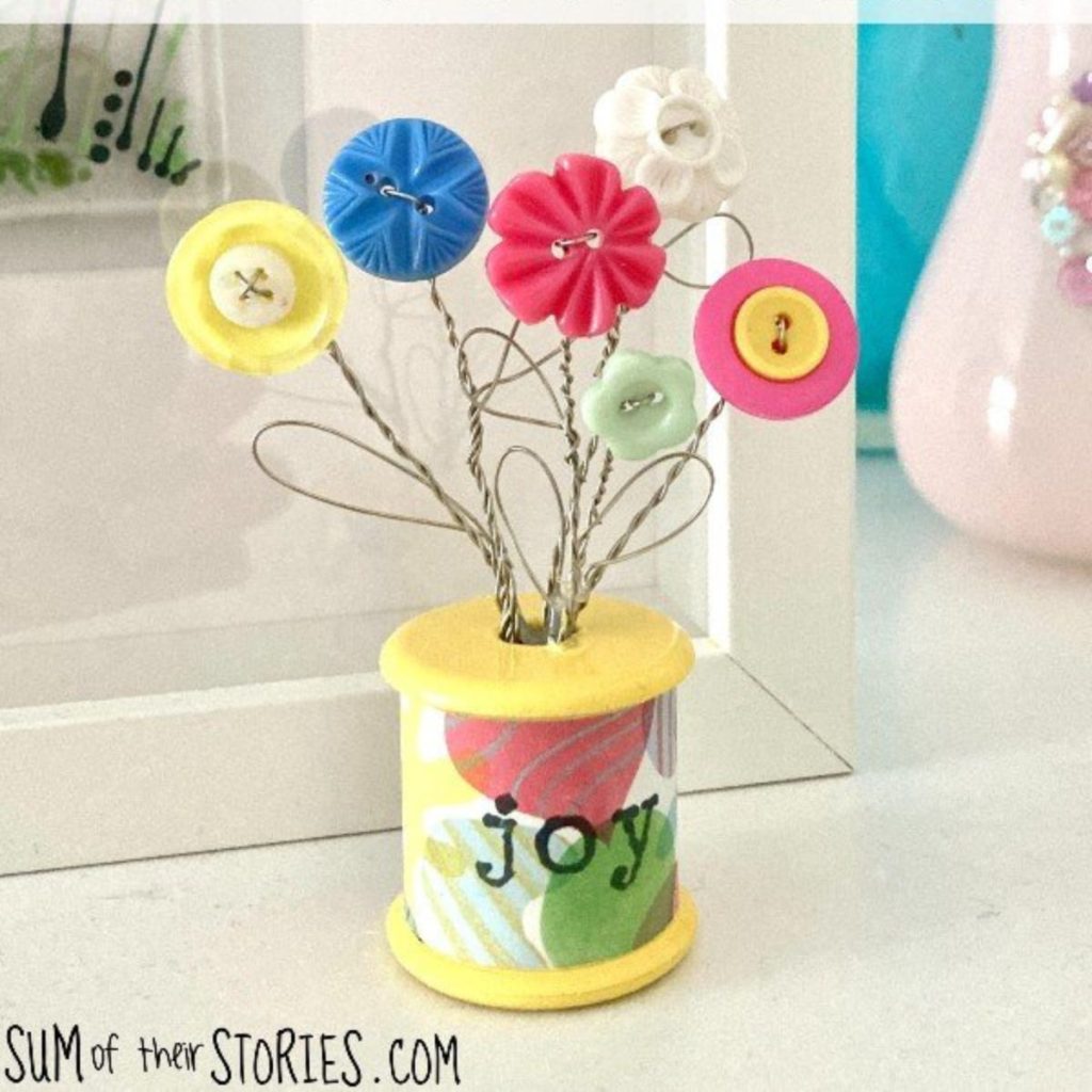 Button Bouquet in a Cotton Reel with joy written on it