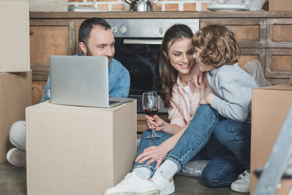 woman with family drinking wine in house