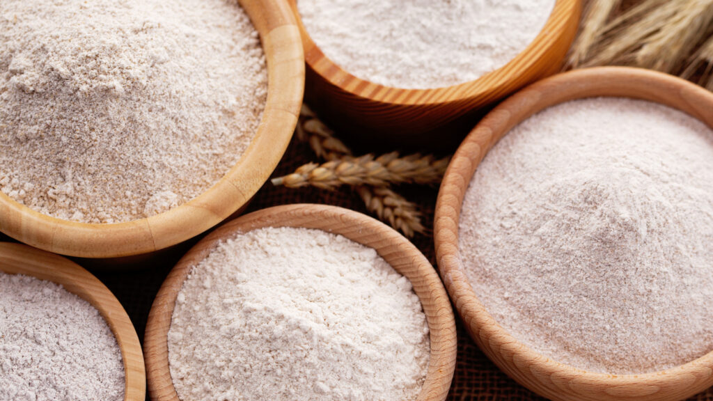 wooden bowls with different types of flour on jute - food and drink