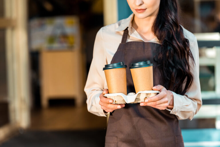 woman taking out coffee