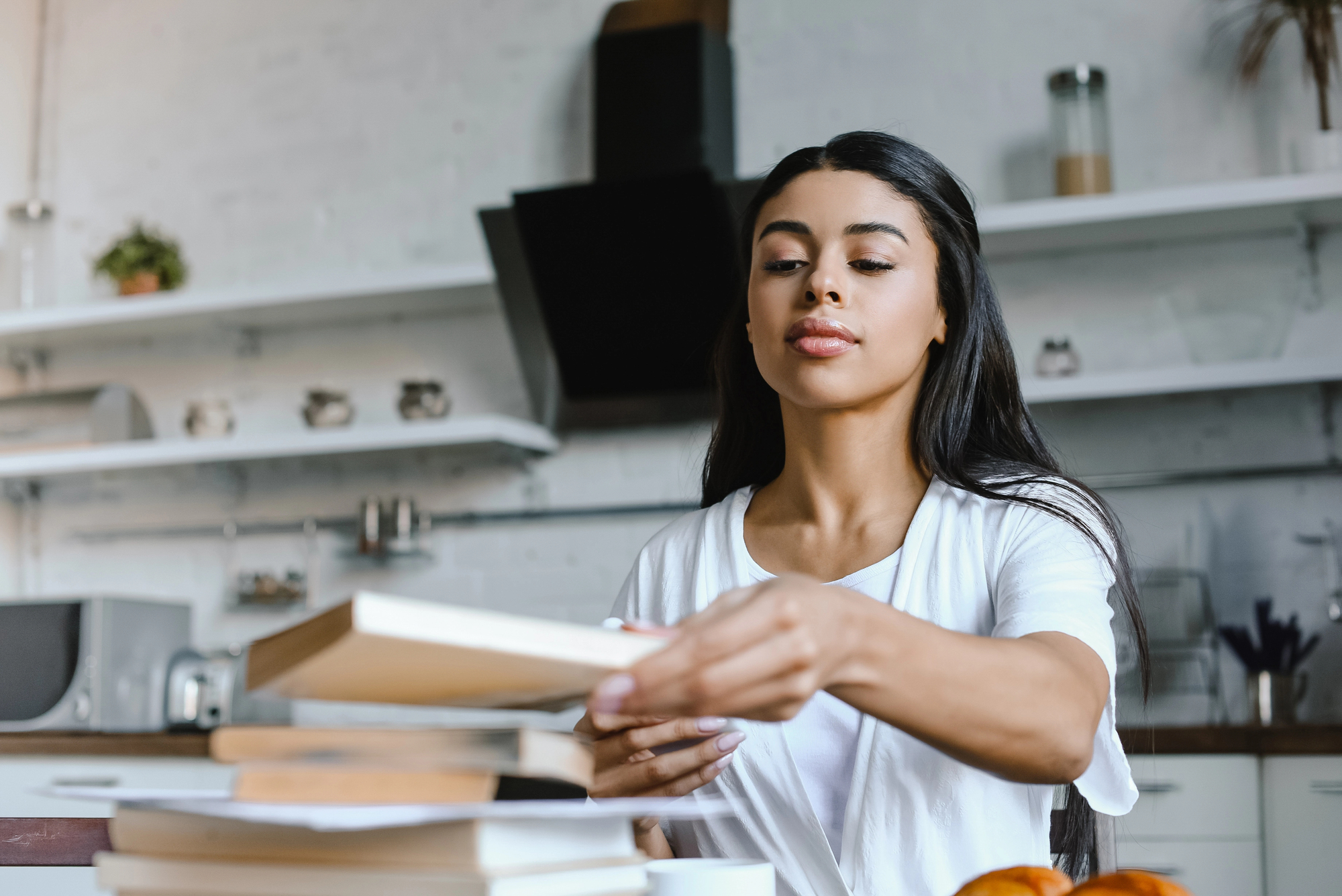 person girl picking up a book