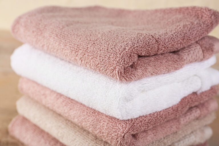 Stack of folded soft towels, closeup