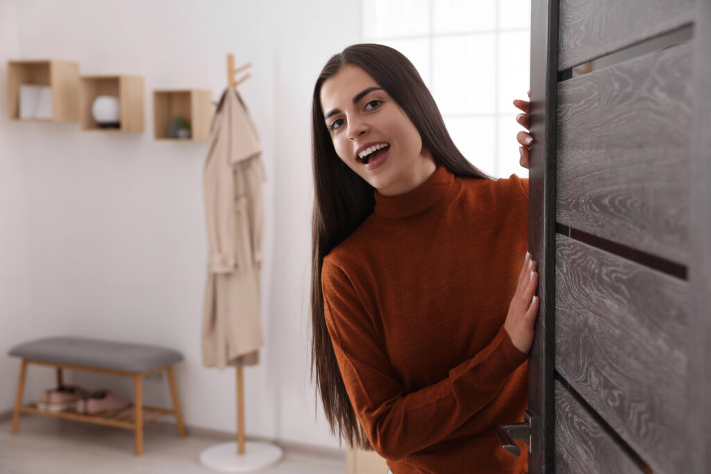 woman standing by door