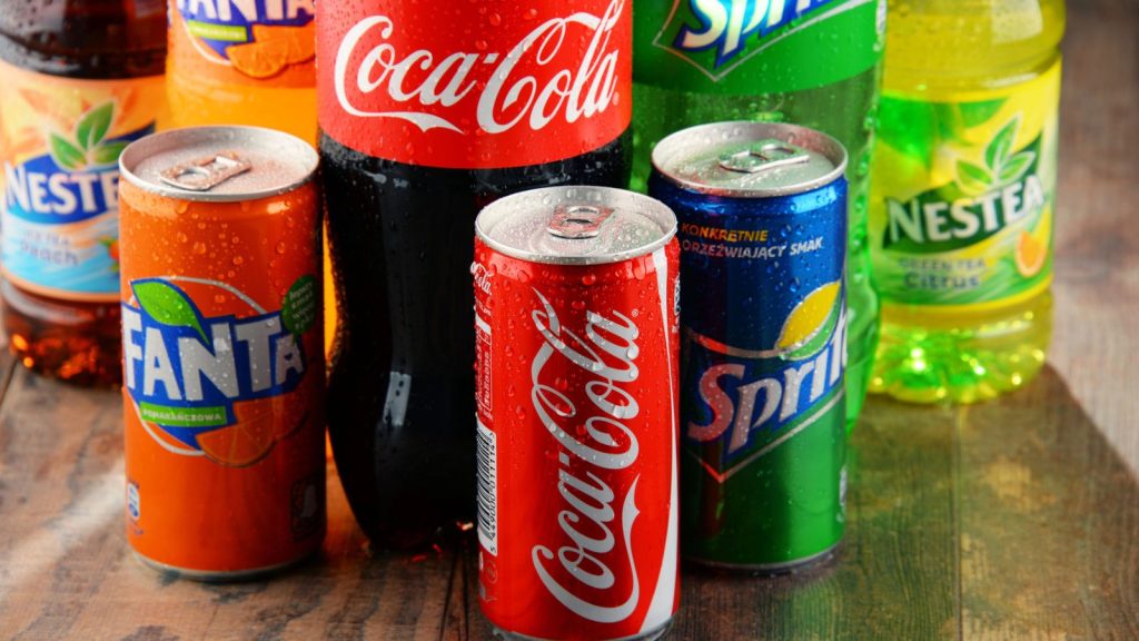 Bottles of assorted Coca Cola Company soft drinks.