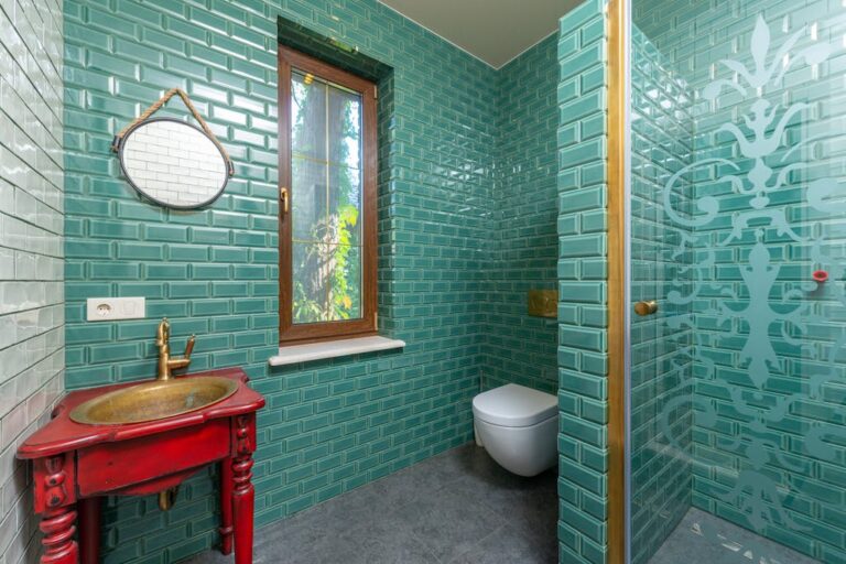 Green Tiled Wall in the Bathroom