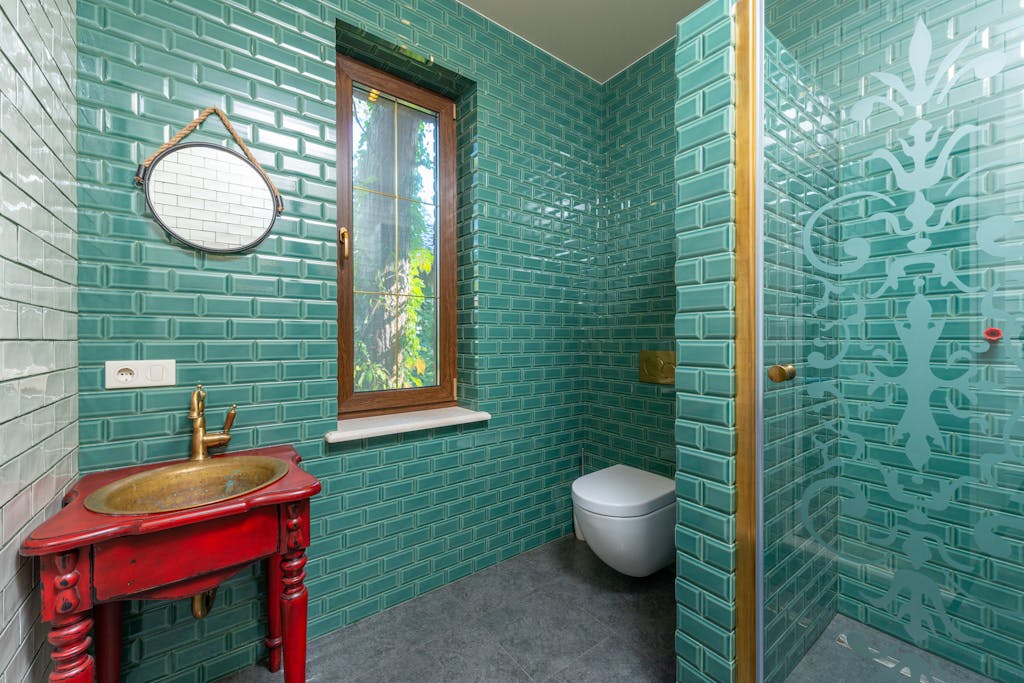 Green Tiled Wall in the Bathroom