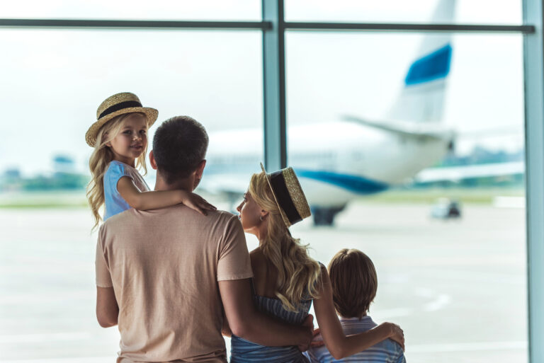family going on vacation in airport