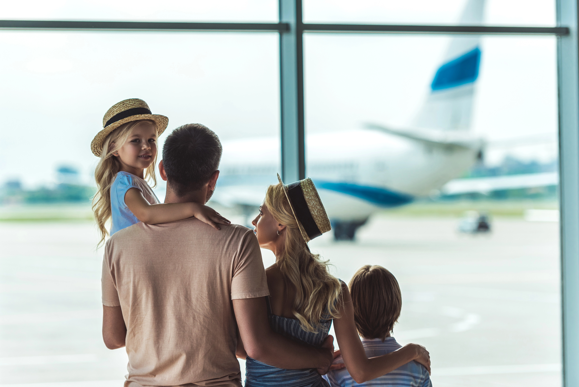 family going on vacation in airport