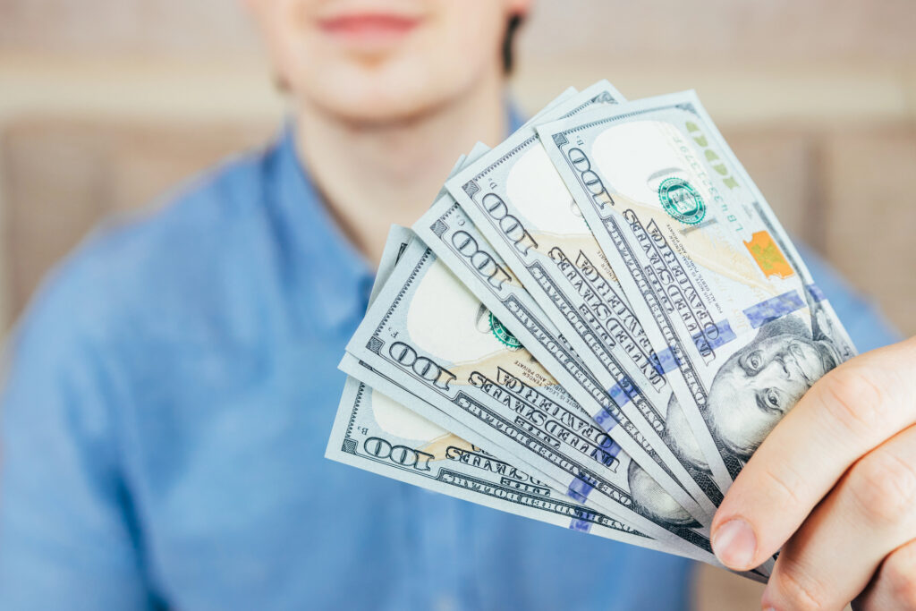 man holding cash