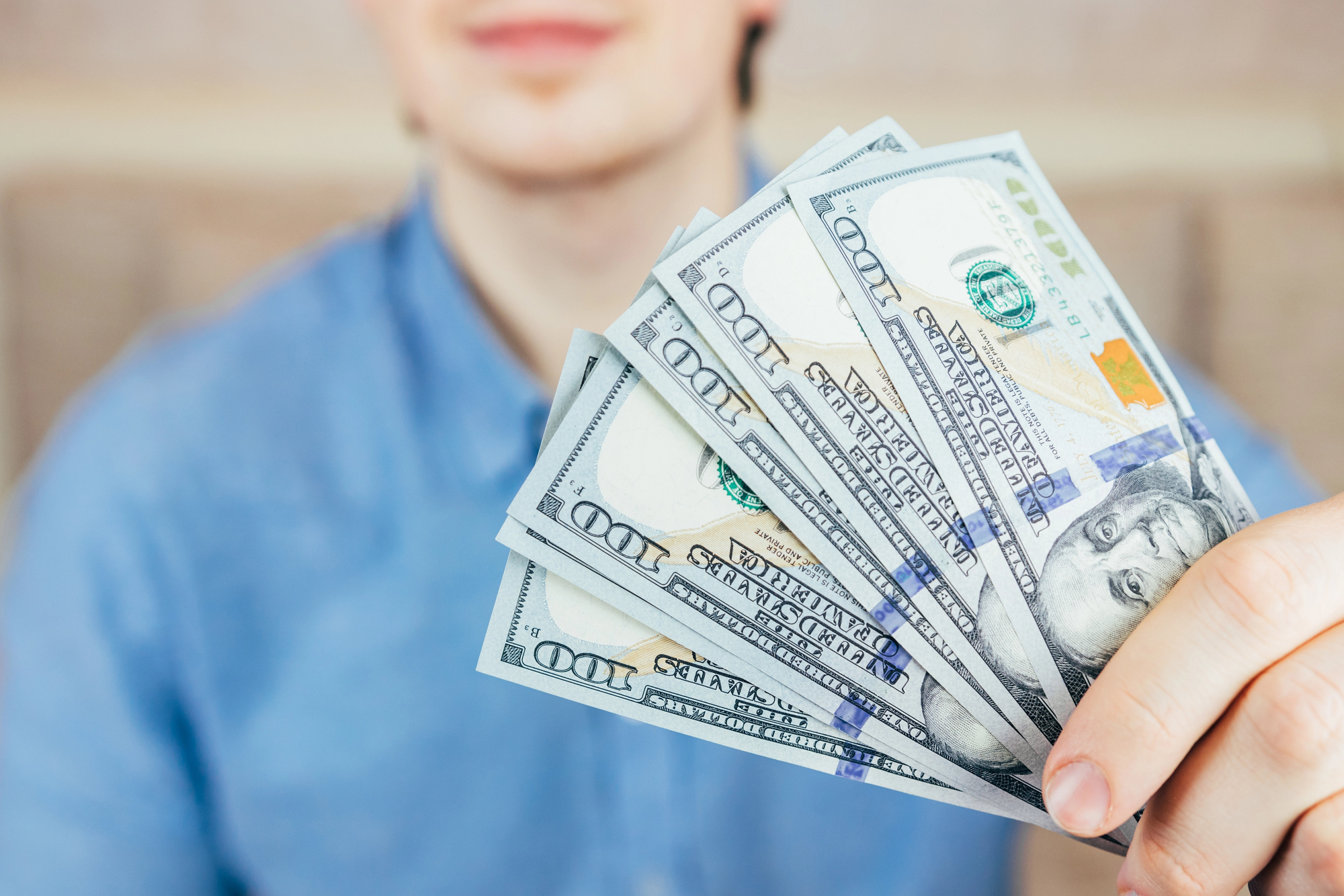 man holding cash