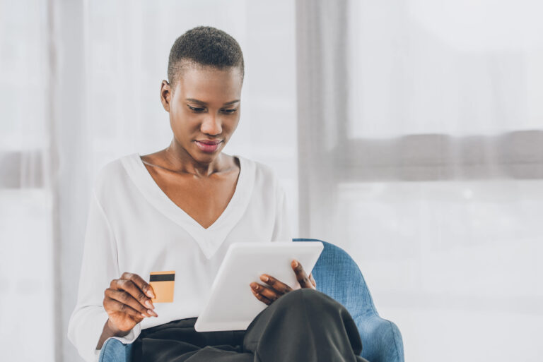 woman looking at credit card