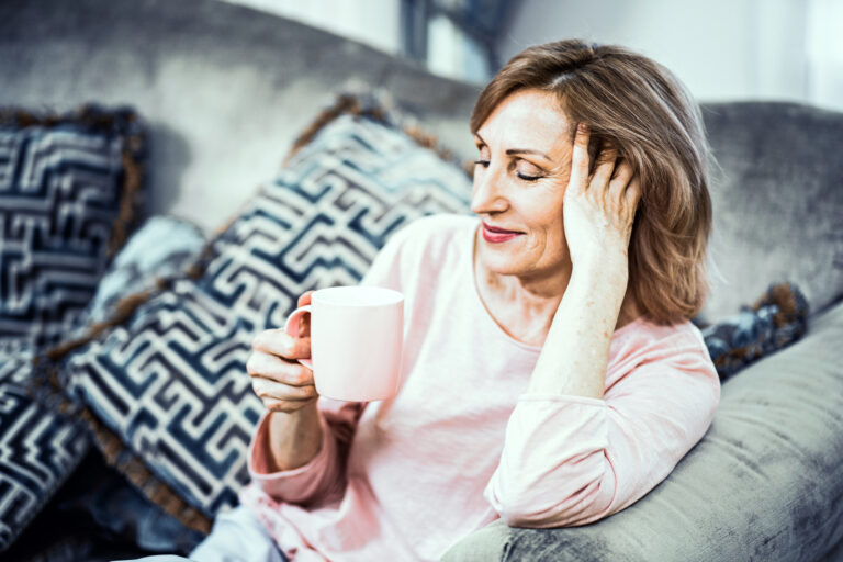 older woman drinking coffee