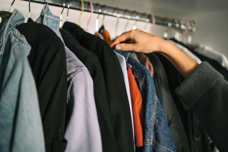 woman taking something out of closet clothes