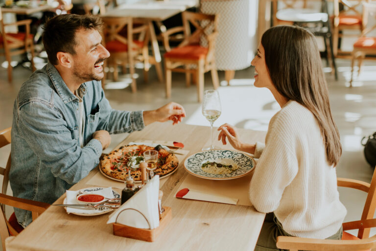 woman and man having dinner at restaurant