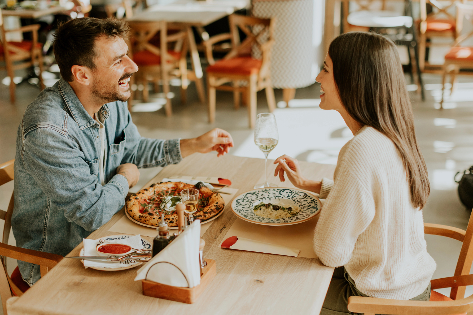 woman and man having dinner at restaurant