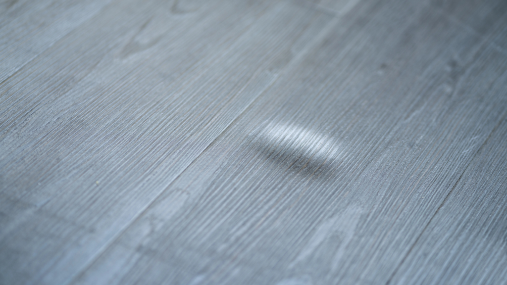 Damaged Wooden Floor. Laminate Scratch. Broken Vinyl Flooring