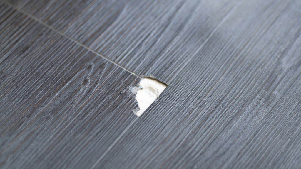 Damaged Wooden Floor. Laminate Scratch. Broken Vinyl Flooring (2)