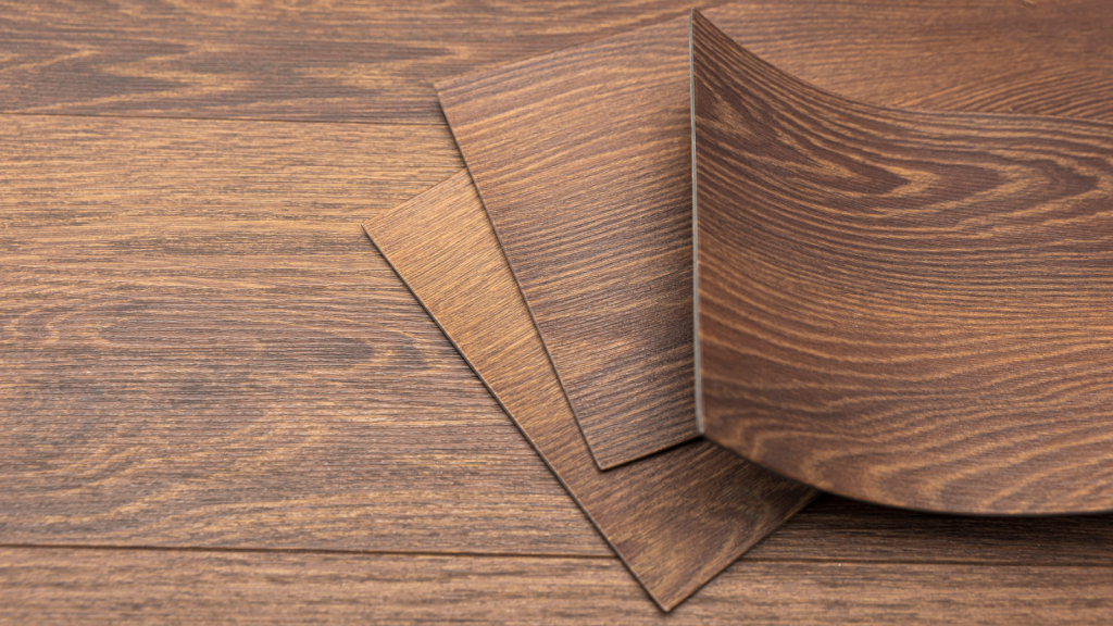 PVC vinyl sample. Vinyl floors. The swatches are brown with a woody texture. Copy space.