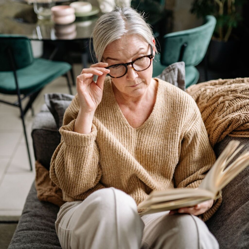 retired woman reading a book