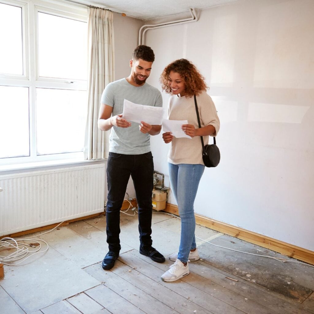 woman and man looking at contracts