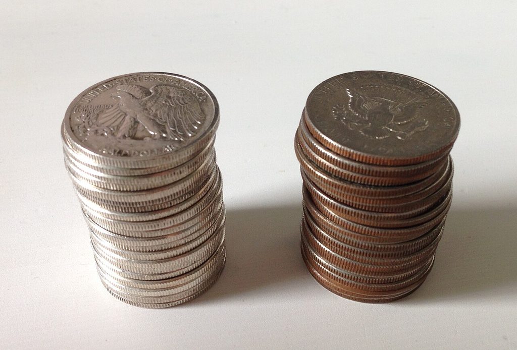 1280px Two stacks of half dollars one silver one clad effects of the Coinage Act 1965