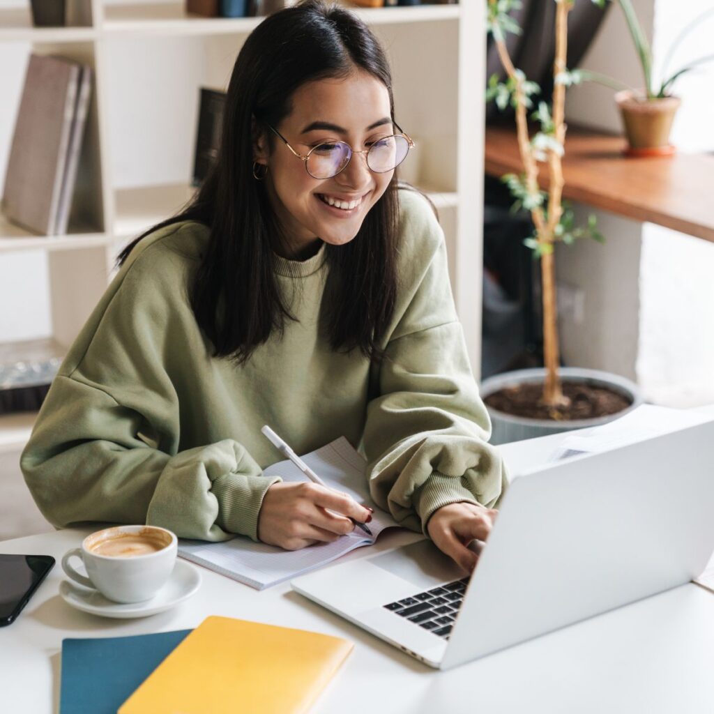 girl smiling on laptop