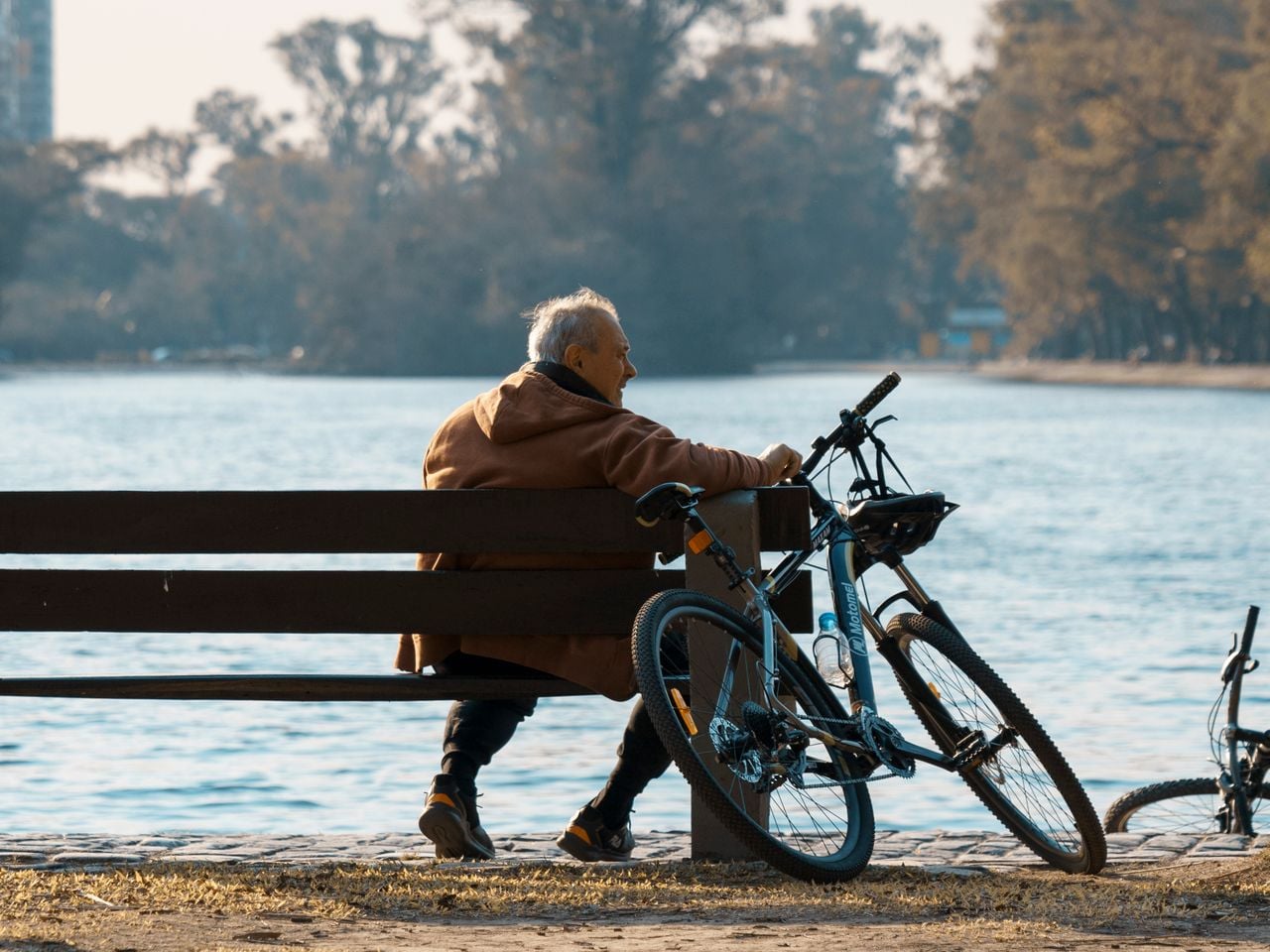 older guy outside with his bike