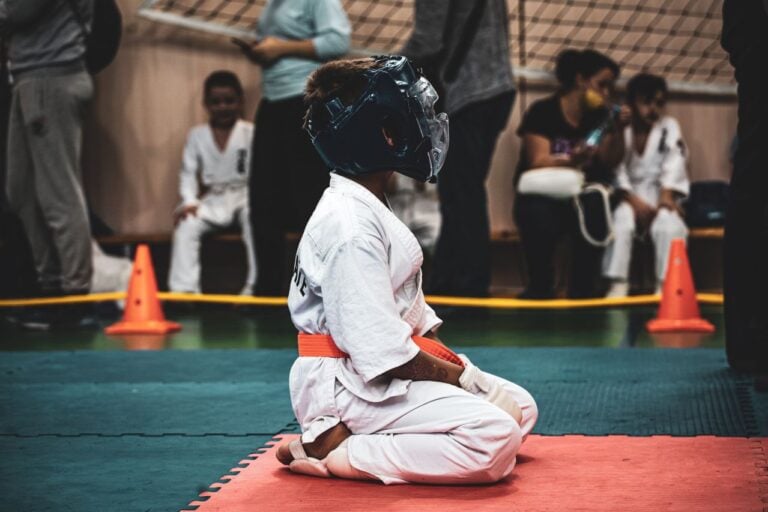 kid in karate outfit sports