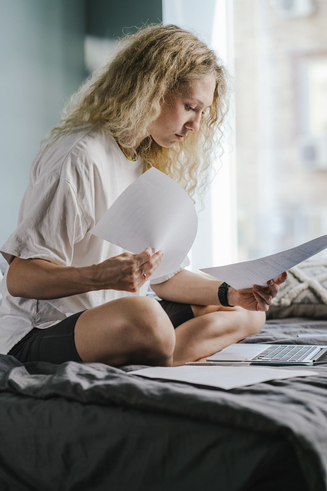 woman looking at bills